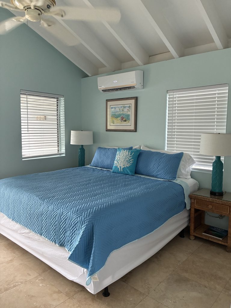 Bougainvillea studio king bed with blue bedding