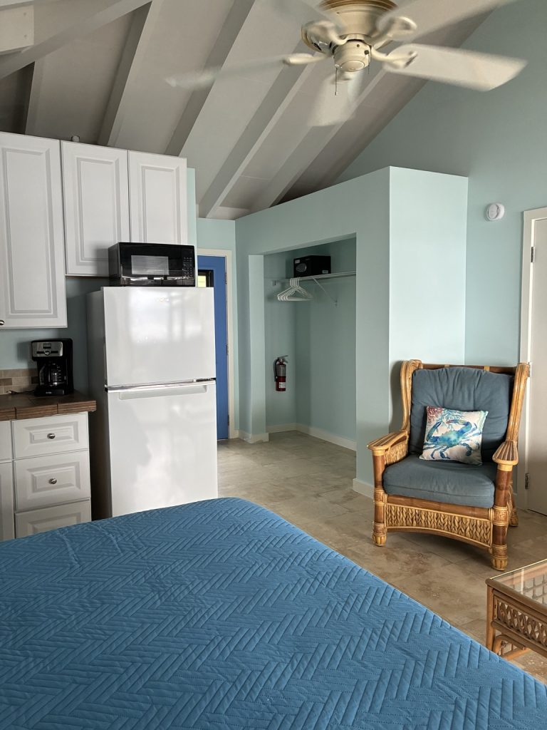 Bougainvillea studio bed, kitchenette, and sitting area
